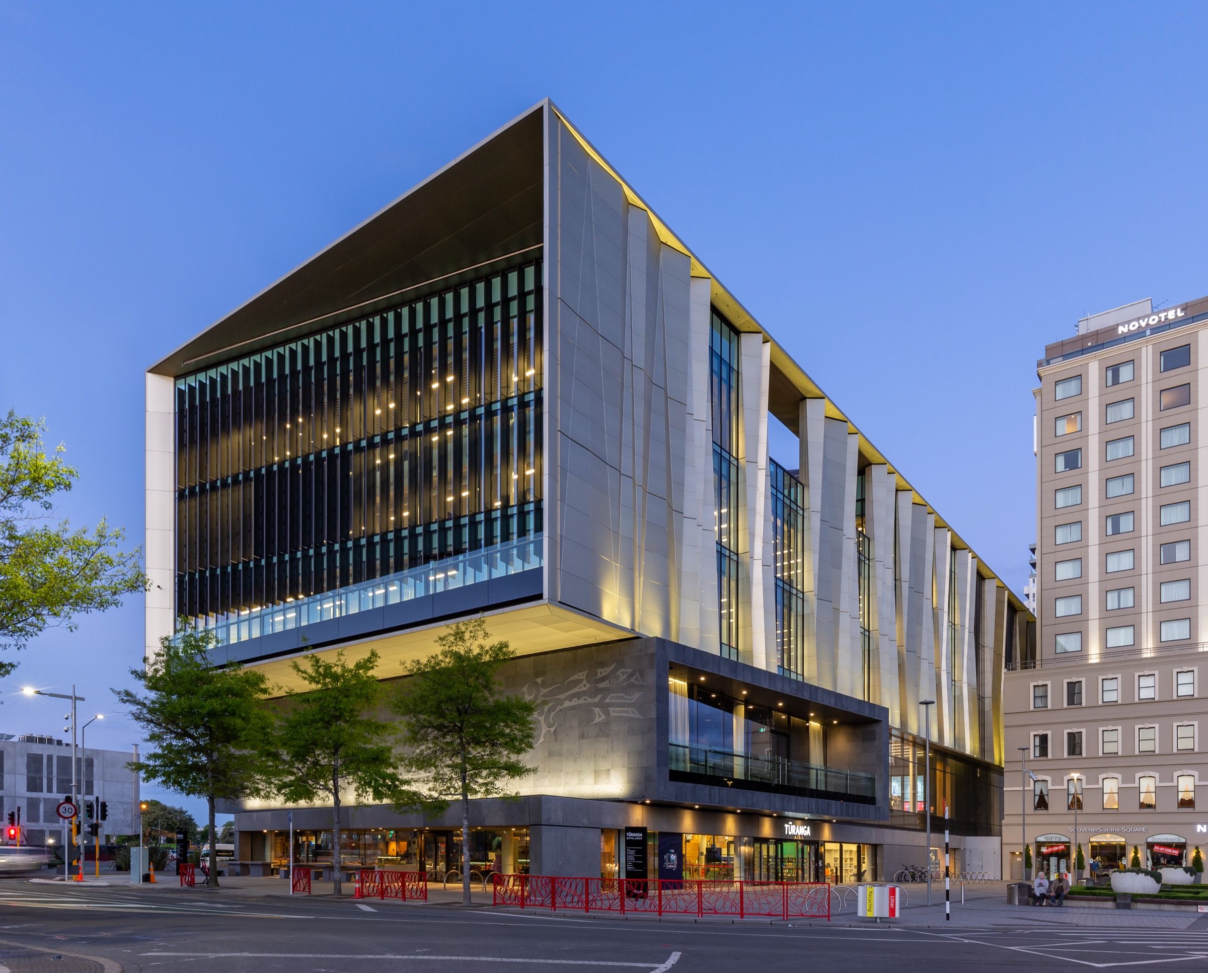 Tūranga, the Christchurch central library, lit up at dusk